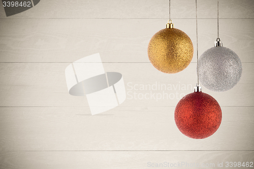 Image of Three Christmas Balls Hanging