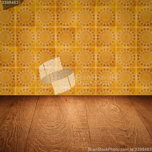 Image of Wood table top and blur vintage ceramic tile pattern wall