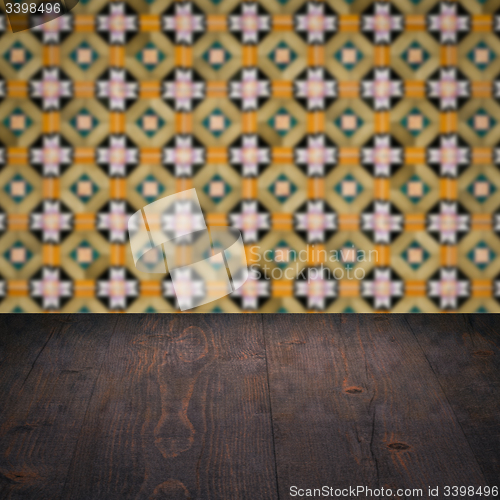 Image of Wood table top and blur vintage ceramic tile pattern wall