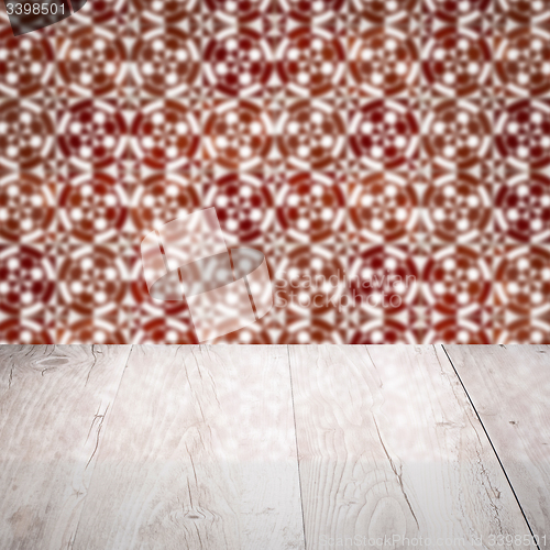 Image of Wood table top and blur vintage ceramic tile pattern wall