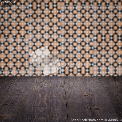 Image of Wood table top and blur vintage ceramic tile pattern wall