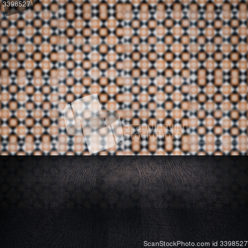 Image of Wood table top and blur vintage ceramic tile pattern wall