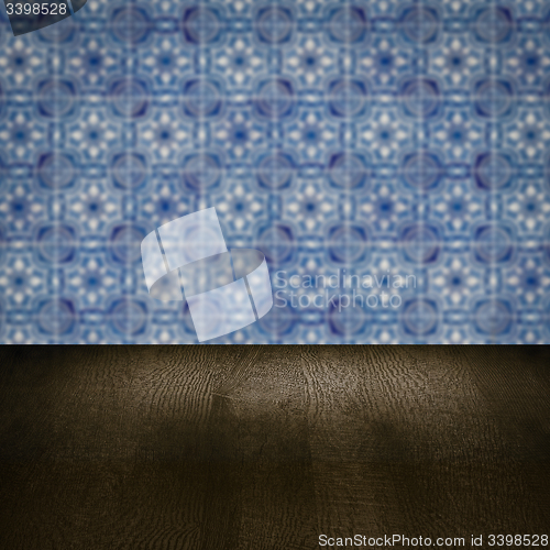 Image of Wood table top and blur vintage ceramic tile pattern wall