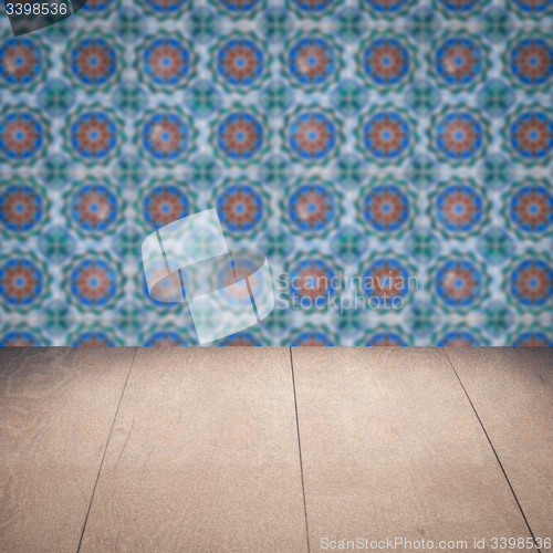 Image of Wood table top and blur vintage ceramic tile pattern wall