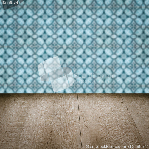 Image of Wood table top and blur vintage ceramic tile pattern wall