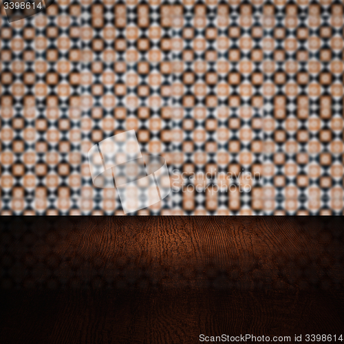 Image of Wood table top and blur vintage ceramic tile pattern wall