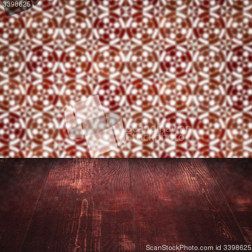 Image of Wood table top and blur vintage ceramic tile pattern wall