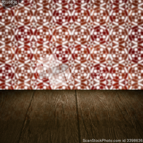 Image of Wood table top and blur vintage ceramic tile pattern wall