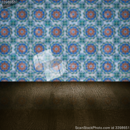 Image of Wood table top and blur vintage ceramic tile pattern wall