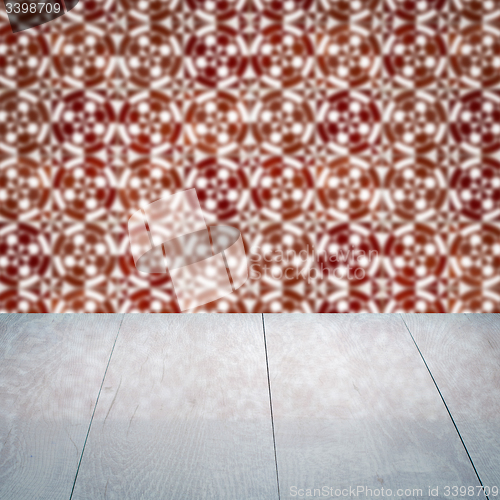 Image of Wood table top and blur vintage ceramic tile pattern wall