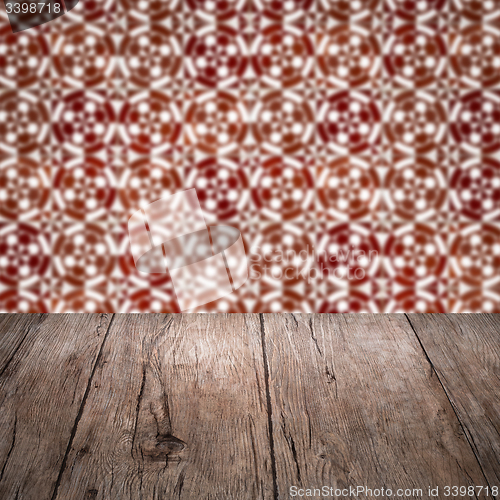 Image of Wood table top and blur vintage ceramic tile pattern wall