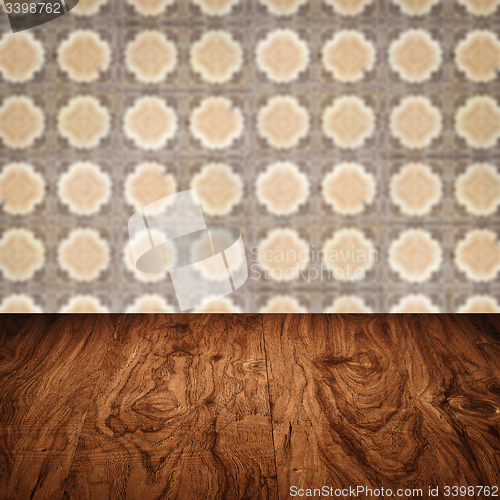 Image of Wood table top and blur vintage ceramic tile pattern wall