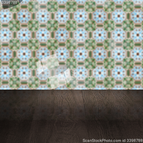 Image of Wood table top and blur vintage ceramic tile pattern wall
