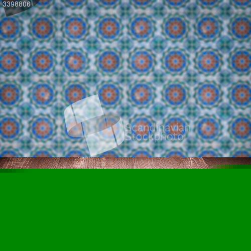 Image of Wood table top and blur vintage ceramic tile pattern wall