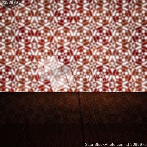 Image of Wood table top and blur vintage ceramic tile pattern wall