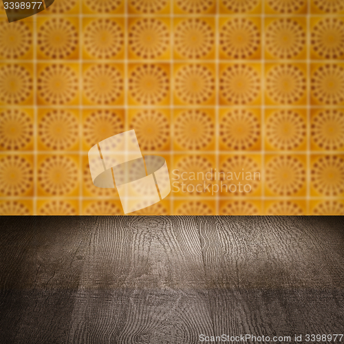 Image of Wood table top and blur vintage ceramic tile pattern wall