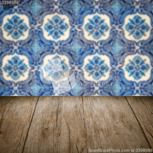 Image of Wood table top and blur vintage ceramic tile pattern wall