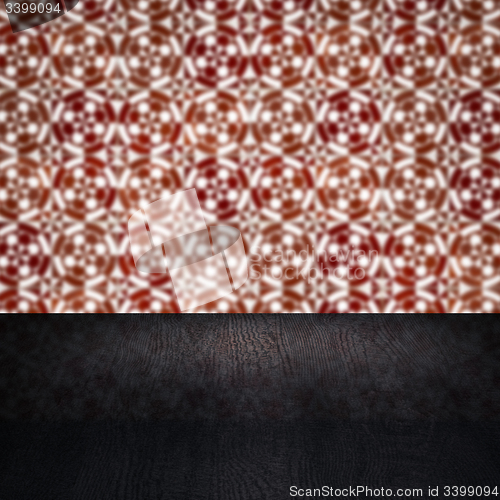 Image of Wood table top and blur vintage ceramic tile pattern wall