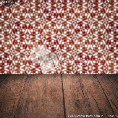 Image of Wood table top and blur vintage ceramic tile pattern wall