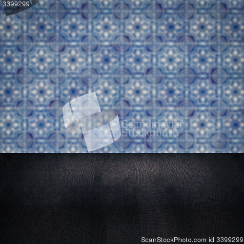 Image of Wood table top and blur vintage ceramic tile pattern wall