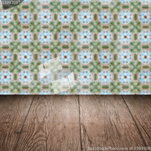 Image of Wood table top and blur vintage ceramic tile pattern wall