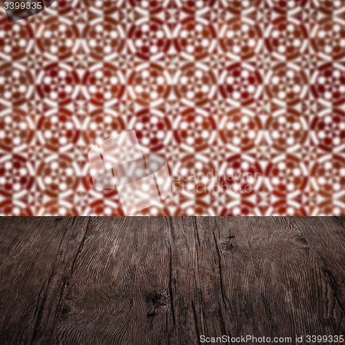 Image of Wood table top and blur vintage ceramic tile pattern wall