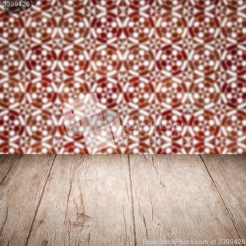 Image of Wood table top and blur vintage ceramic tile pattern wall
