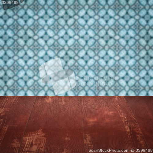 Image of Wood table top and blur vintage ceramic tile pattern wall