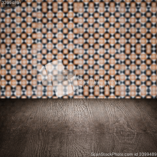 Image of Wood table top and blur vintage ceramic tile pattern wall