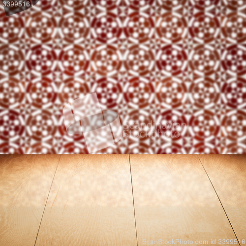 Image of Wood table top and blur vintage ceramic tile pattern wall