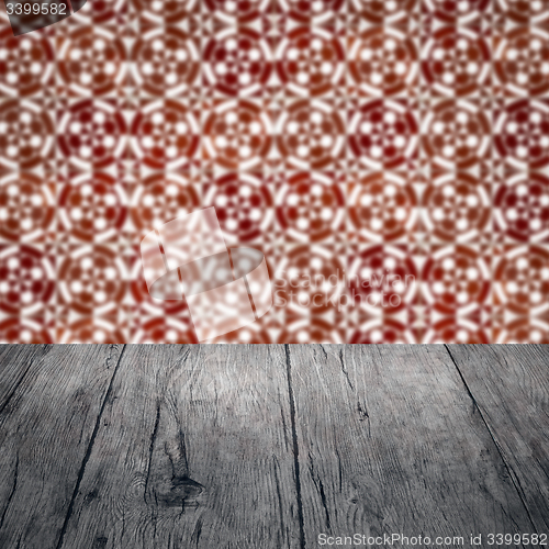 Image of Wood table top and blur vintage ceramic tile pattern wall