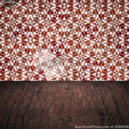 Image of Wood table top and blur vintage ceramic tile pattern wall