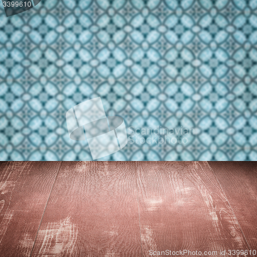 Image of Wood table top and blur vintage ceramic tile pattern wall