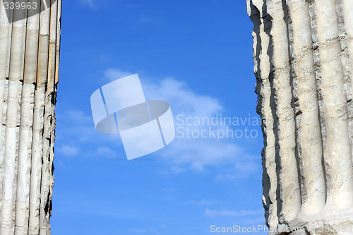 Image of Blue clouded sky between two ancient Greek columns
