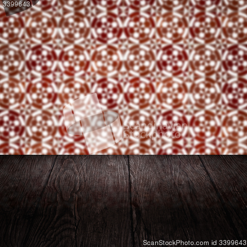 Image of Wood table top and blur vintage ceramic tile pattern wall