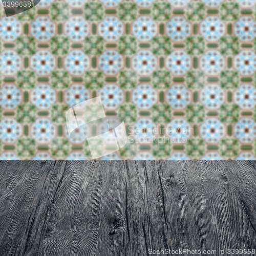 Image of Wood table top and blur vintage ceramic tile pattern wall