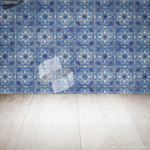 Image of Wood table top and blur vintage ceramic tile pattern wall