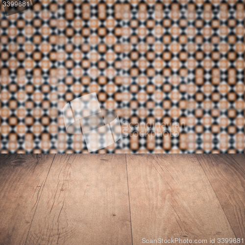 Image of Wood table top and blur vintage ceramic tile pattern wall