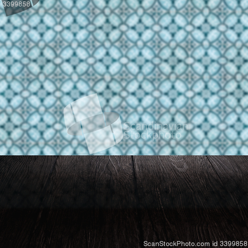 Image of Wood table top and blur vintage ceramic tile pattern wall