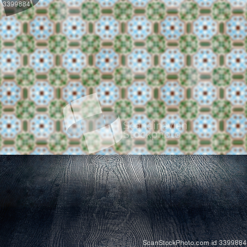 Image of Wood table top and blur vintage ceramic tile pattern wall