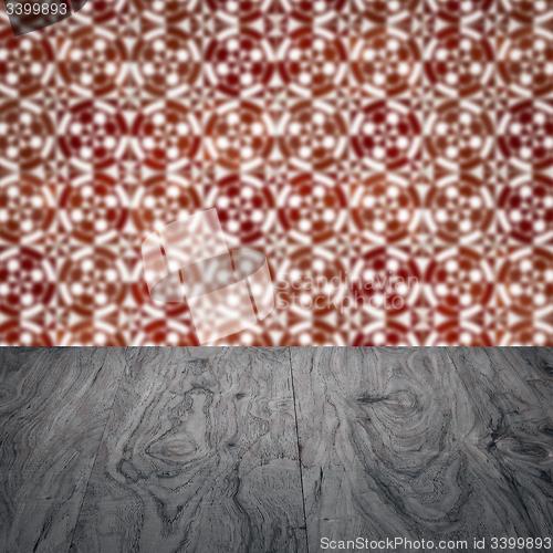 Image of Wood table top and blur vintage ceramic tile pattern wall