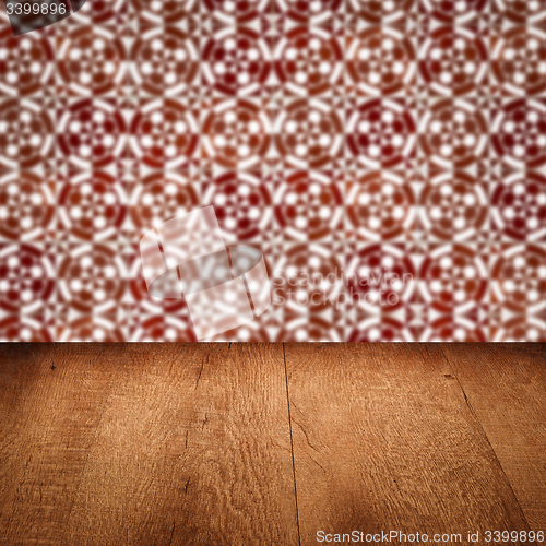 Image of Wood table top and blur vintage ceramic tile pattern wall