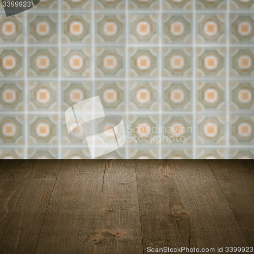 Image of Wood table top and blur vintage ceramic tile pattern wall