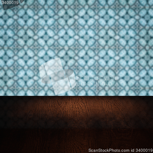 Image of Wood table top and blur vintage ceramic tile pattern wall