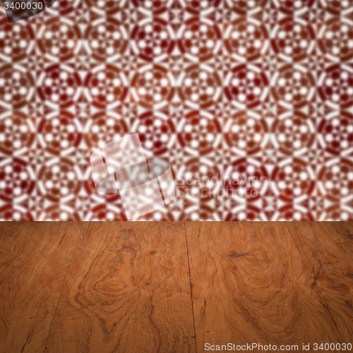 Image of Wood table top and blur vintage ceramic tile pattern wall