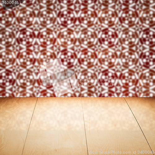 Image of Wood table top and blur vintage ceramic tile pattern wall