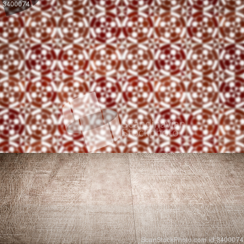 Image of Wood table top and blur vintage ceramic tile pattern wall