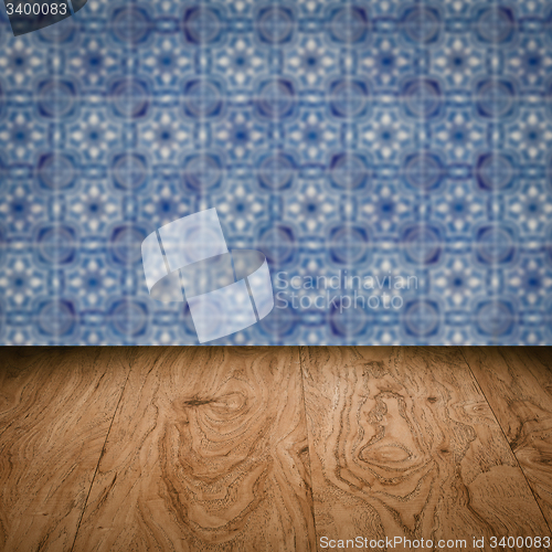 Image of Wood table top and blur vintage ceramic tile pattern wall