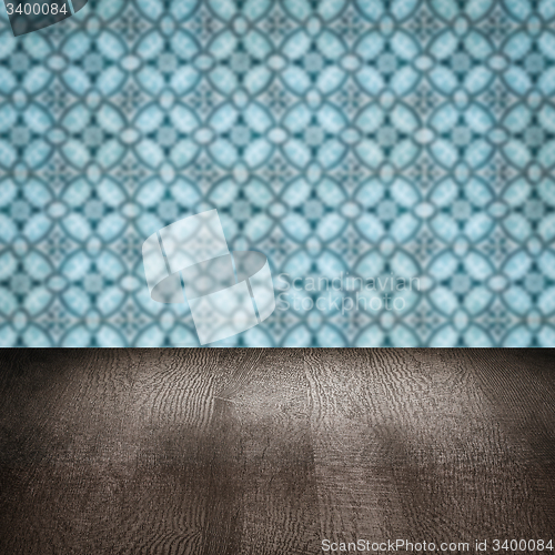 Image of Wood table top and blur vintage ceramic tile pattern wall