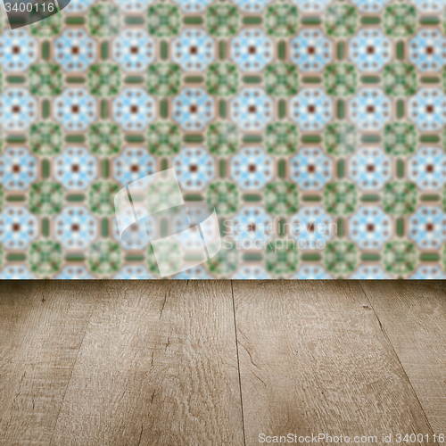 Image of Wood table top and blur vintage ceramic tile pattern wall